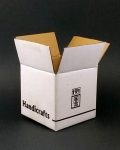 white shipping box featuring "Handcrafts" in a single color print, made from sturdy 3-ply corrugated cardboard.