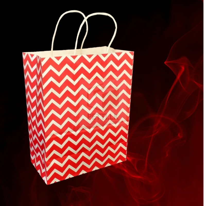 Striking red and white chevron paper bag with sturdy white handles, perfect for stylish shopping or gift wrapping