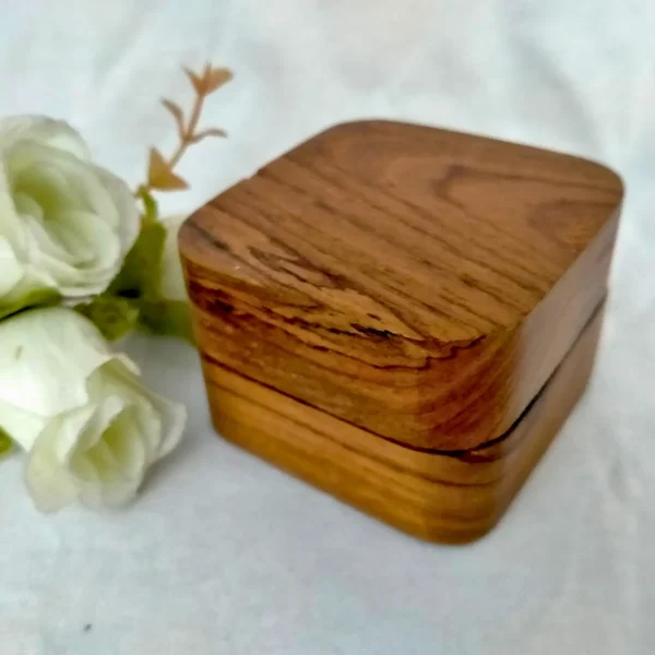 A square wooden jewelary box