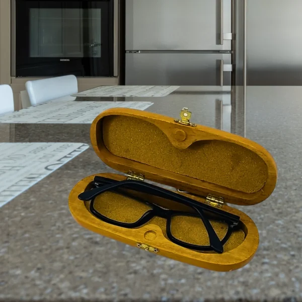 Stylish eyeglasses case with teak wood, brass lock, and cork inlay for secure storage and scratch protection.