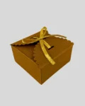 Craft paper gift box with a scalloped lid and golden ribbon, perfect for chocolates, wedding favors, and small gifts.