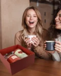 Red self-care gift box with candle, fragrance, and heart-themed mug – ideal for gifting someone special