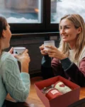 Red self-care gift box with candle, fragrance, and heart-themed mug – ideal for gifting someone special