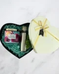 Heart-shaped gift box with candle, stainless steel water bottle, and potted plant – a thoughtful gift for a friend