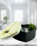 Heart-shaped gift box with candle, stainless steel water bottle, and potted plant – a thoughtful gift for a friend