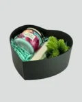 Heart-shaped gift box with candle, stainless steel water bottle, and potted plant – a thoughtful gift for a friend