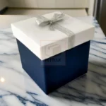 White And Blue Gift Box With Silver Ribbon