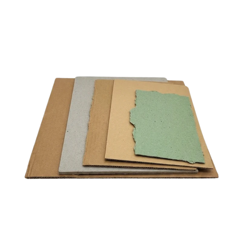 Different types of packaging paper and cardboard materials arranged on a table