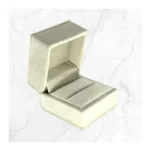 Premium White Velvet Ring Box featuring a luxury engagement ring on a wedding-themed background.