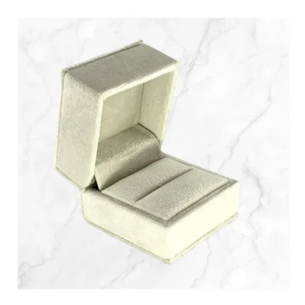 Premium White Velvet Ring Box featuring a luxury engagement ring on a wedding-themed background.