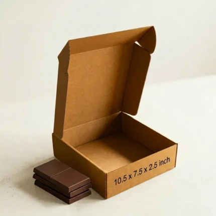 An open kraft brown 3 ply corrugated box displaying dimensions 10.5x7.5x2.5 inch
