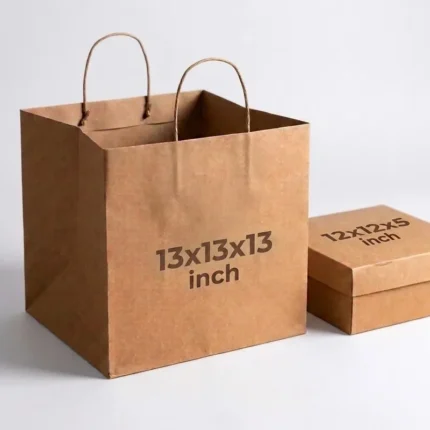 Extra large Kraft paper cake bag measuring 13x13x13 inches with twisted handles alongside a 12x12x5 inch cake box