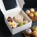 Premium open white multi-use cupcake box configured for 1 bento cake and 5 cupcakes via the perforated insert tray showing 10x10x6 inch size dimensions