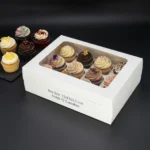 Premium white 12-cupcake box with an oversized clear window and custom internal tray showing 13x9.5x3.5 inch size dimensions